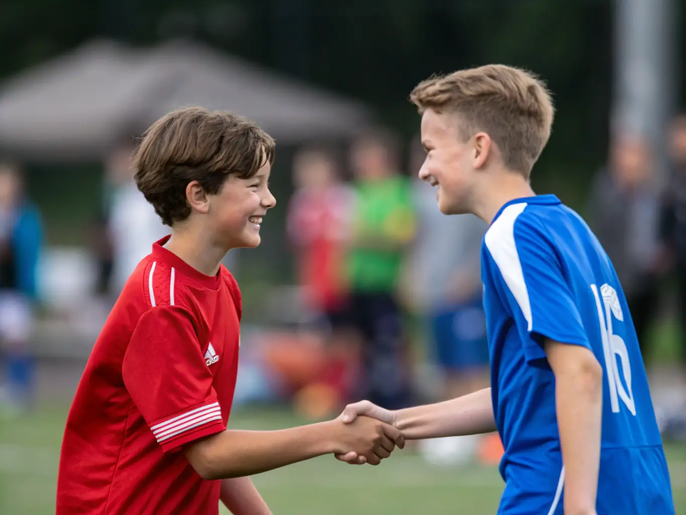 An inspiring image of FOOTBALL-CLUB DE NERONDES players shaking hands after a match, symbolizing fair play, respect, and the importance of sportsmanship in fostering positive relationships.